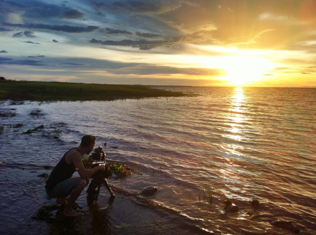 LAKE KARIBA MATUSADONA NATIONAL PARK ZIMBABWE AFRICA: Matthew Hood filming the sunset. (Photo Credit: MATTHEW HOOD/ DON PERCIVAL/ Goddunnit Promotions)